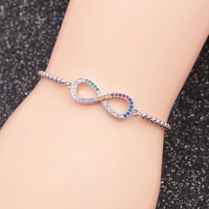 Detail of infinity charm bracelet with colorful cubic zirconia on adjustable chain