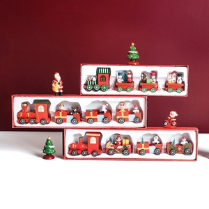 Festive wooden Christmas train set with Santa and snowman figurines for holiday tabletop decor