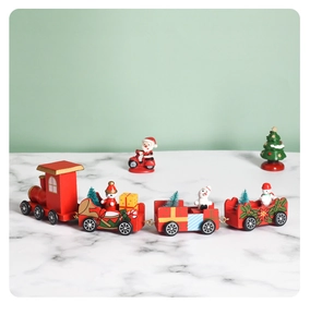 Detailed close-up of a red wooden Christmas train with snowman and tree decorations