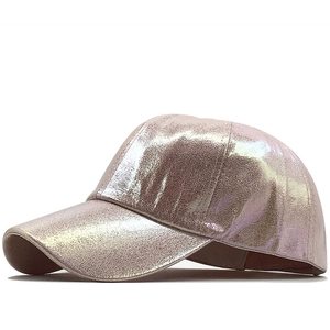 Close-up of metallic pink PU leather baseball cap with textured cracked finish and curved brim