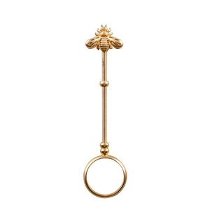 Detailed view of golden bee cigarette ring holder with long handle on white background