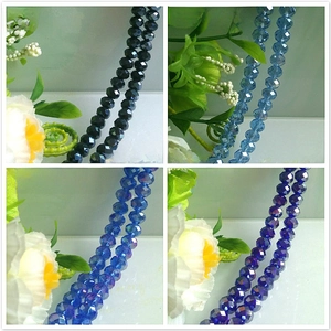 Faceted glass beads in black, light blue, medium blue and dark blue AB colors