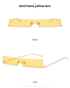 Close-up of retro narrow gold frame sunglasses with transparent yellow lenses