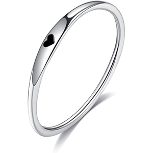 Macro detail of slim stainless steel ring featuring a black enamel heart decoration