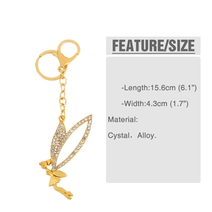 Macro shot showing dimensions of golden fairy wing keychain with crystal rhinestones