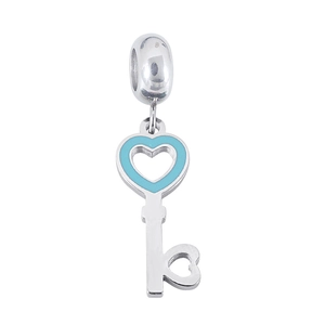 Macro view of silver heart key pendant with blue enamel inlay and stainless steel ring