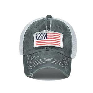 Close-up of vintage washed cotton baseball cap with embroidered American flag patch