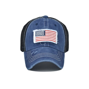 Close-up of vintage washed blue cotton baseball cap with American flag embroidery
