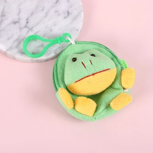 Detail of plush frog coin purse with green zipper and plastic hook on pink surface