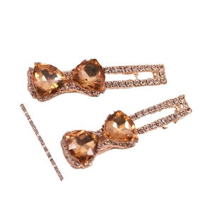 Barrettes à cheveux cœurs en cristal champagne avec base dorée et strass brillants