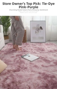 Close-up of soft purple tie-dye plush rug featuring long pile texture on wooden floor