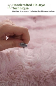 Detail of pink tie-dye shaggy rug showing non-shedding long pile soft texture