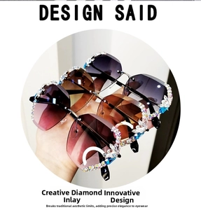 Detailed view of three rimless oversized sunglasses with colorful rhinestone butterfly accents