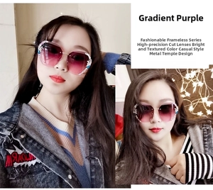 Close-up of rimless purple gradient sunglasses with crystal trim and gold metal temples
