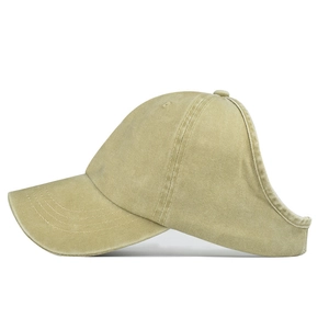 Detail of high ponytail opening and washed cotton texture on khaki sun baseball cap