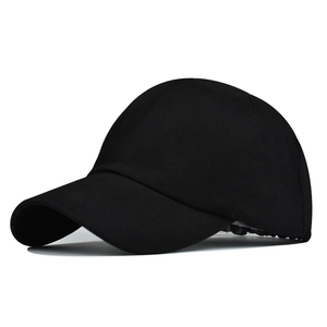 Detail view of the black ponytail baseball cap with a curved brim and breathable top vents