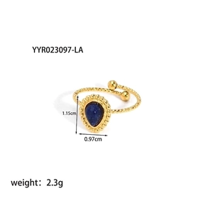 Detail view of gold twisted ring with pear-cut blue stone showing dimensions and weight