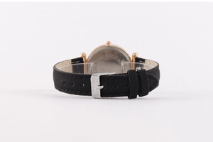 Detail of the stainless steel back cover and black leather strap with silver buckle