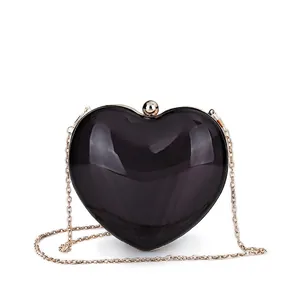 Translucent black heart-shaped acrylic evening clutch bag with gold chain strap