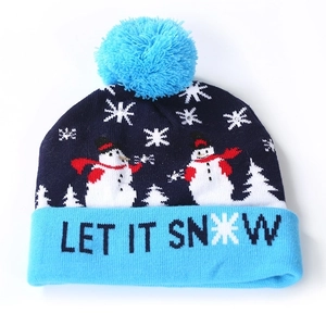 Blue Christmas knit hat with snowman pattern and LED lights and Let It Snow text