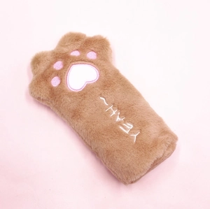 Detail of plush brown cat paw pencil case featuring soft pink embroidery and YEAH text