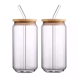 Set of two 16oz can-shaped glass cups with bamboo lids and curved glass straws