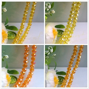 Macro detail of multifaceted Golden and Orange Yellow AB coated crystal glass beads