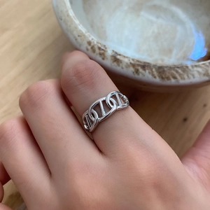 Close-up of 925 sterling silver anchor chain ring on finger with mirror-like finish