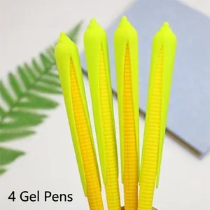 Close-up of 4 yellow corn-shaped gel pens with green leaves on a blue notebook