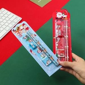 Christmas stationery set with pencils, ruler and eraser in festive red and blue theme