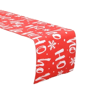 Red Christmas table runner with white snow and HO HO HO print for festive holiday decor