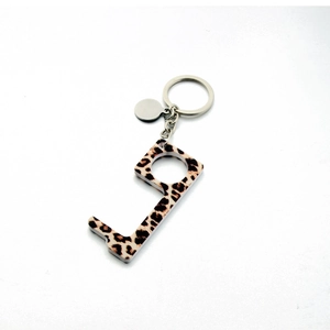 Detailed shot of leopard print contactless door opener with metal keychain ring