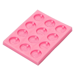 Pink 12-cavity silicone mold for aromatherapy pendants with embossed coin patterns