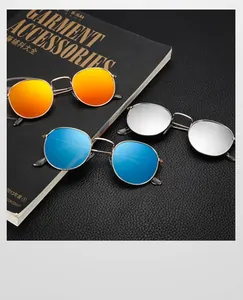 Detail of colorful reflective cat-eye sunglasses with orange, blue, and silver lenses