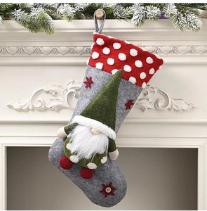 Detail of 20-inch Christmas stocking featuring a 3D plush gnome on a grey felt fabric