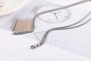 Detail of silver titanium steel box chain necklace with a secure lobster clasp