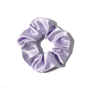 Close-up of a light purple satin hair scrunchie with a glossy silk texture and soft folds