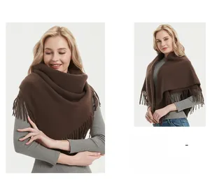 Detail shot of a dark brown warm winter scarf featuring soft fringes and thick texture