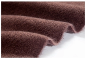 Close-up detail of soft dark brown fabric texture with plush warm winter material