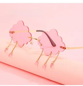 Detail of cloud-shaped sunglasses with pink lenses and dangling waterdrop beads