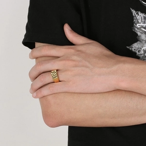 Men's wide hammered texture gold ring in durable stainless steel shown on model