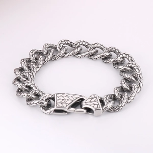 Macro view of vintage silver steel chain bracelet with intricate textured link details