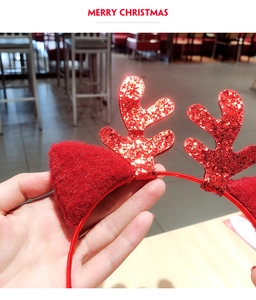 Detail of a red sequin reindeer antler headband for Christmas festive decoration