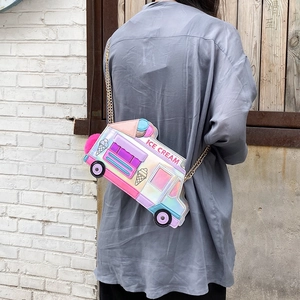 Holographic ice cream truck crossbody bag with metal chain shown on model back view