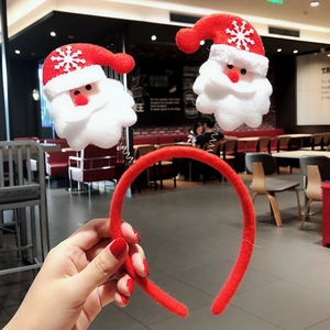 Red Christmas headband with cartoon Santa Claus motifs for festive party hair decoration