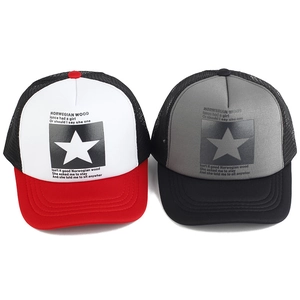 Detailed view of mesh trucker hats with star print in red-white and black-grey combos