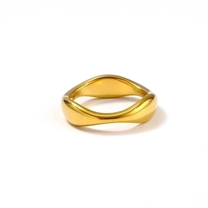 Minimalist gold plated stainless steel irregular wave ring with a polished finish