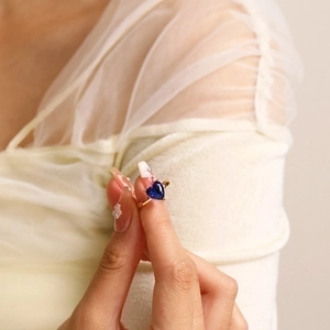 Minimalist 18k gold plated stainless steel ring with a heart-shaped blue zircon stone