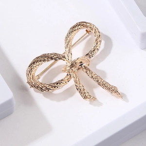 Elegant gold twisted rope butterfly brooch with a stylish 3D metallic texture design