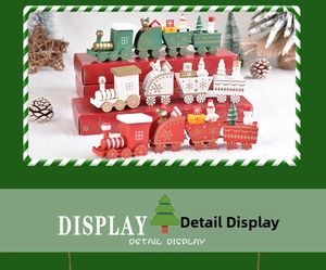 Macro detail of wooden Christmas train set with miniature snowmen and festive trees